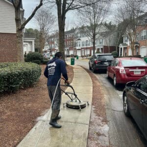 Man doing pressure washing in suwanee georgia sidewalk in suwanee georgia