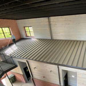 Person cleaning indoor gutters in suwanee georgia