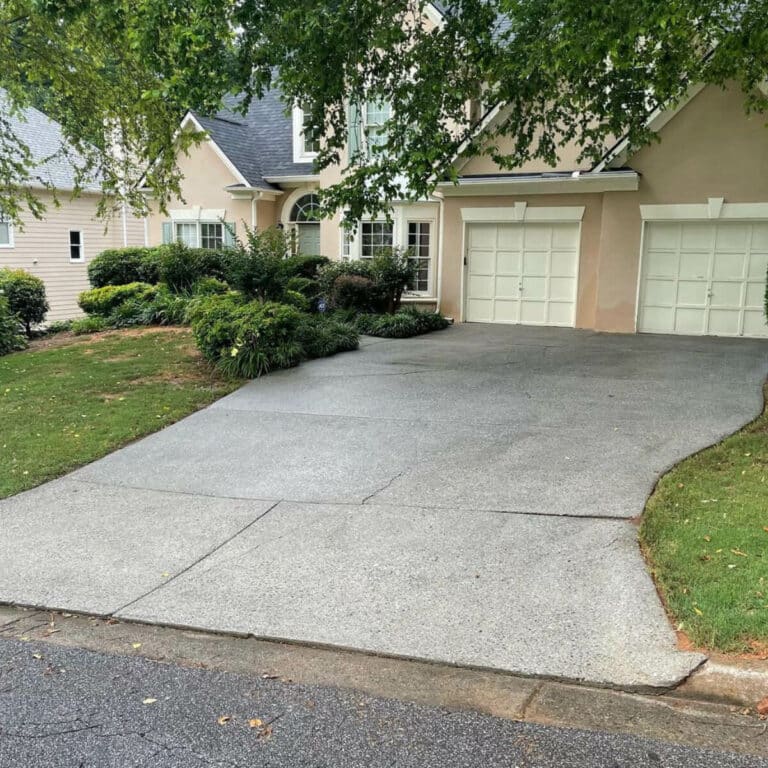 clean concrete driveway after pressure washing service in sugar hill georgia