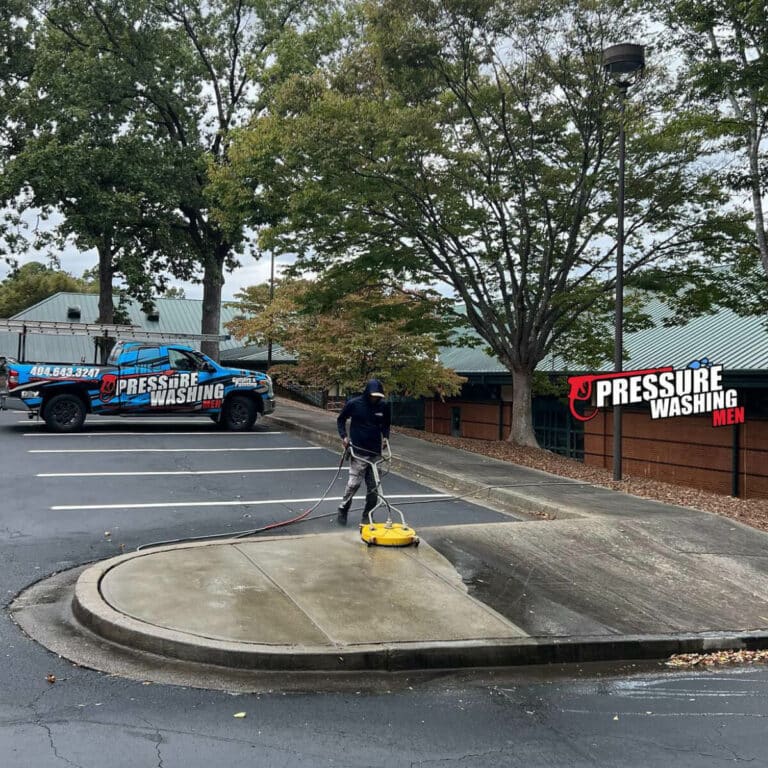 concrete pressure washing service in parking lot in johns creek georgia